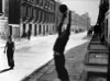 Footballer Jumping, Sunny Bridley Road, Harrow Road1957© Roger Mayne
